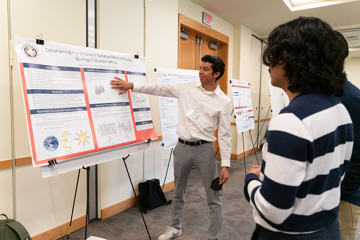 student presents poster during ChEGSA Symposium